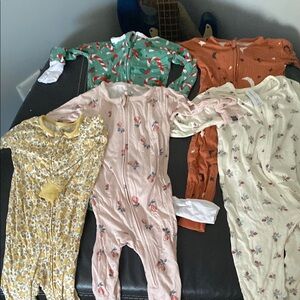 Assorted Baby Onesies with Floral and Holiday Patterns